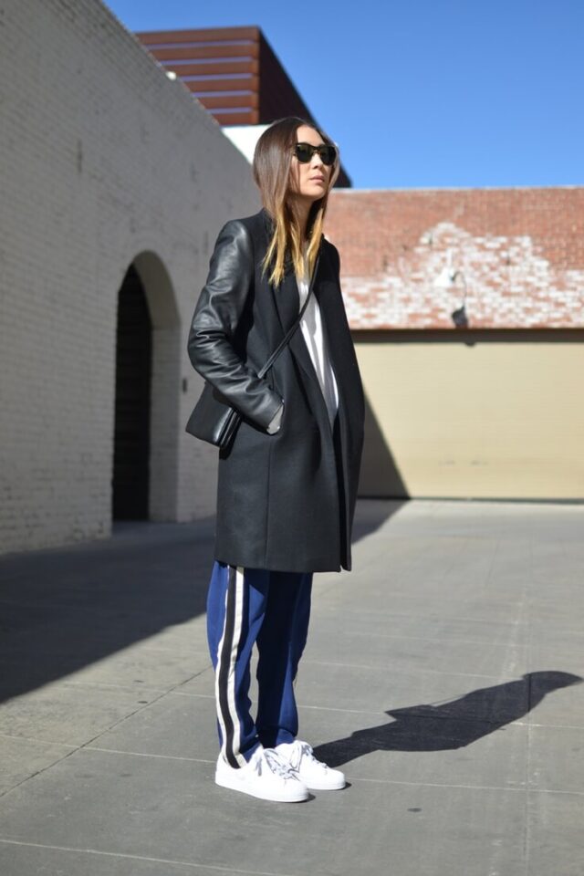 Sneakers and leather raincoat