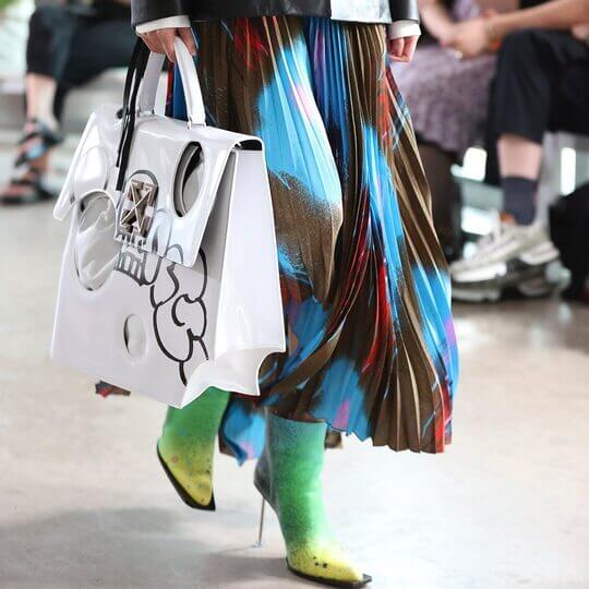 Ankle boots with colored skirt