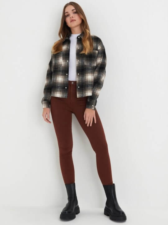 With boots and shirt
