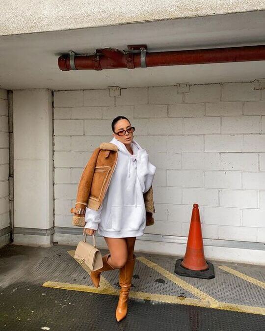 With sheepskin coat and boots