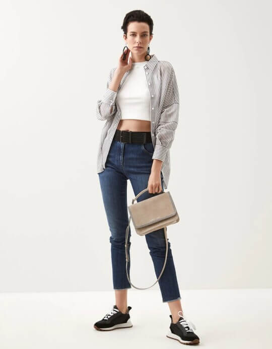 With sneakers and shirt