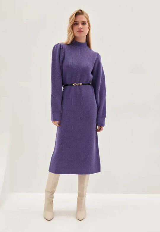 With belt and boots