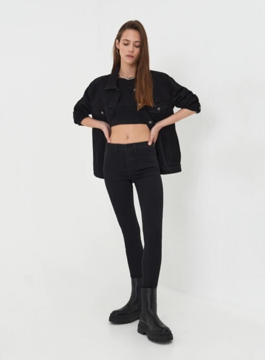With top and black jeans