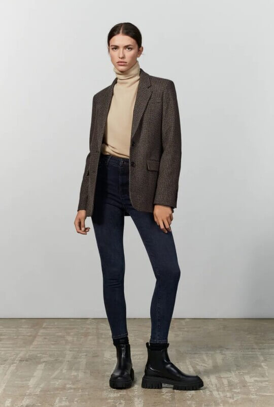 With turtleneck and jacket