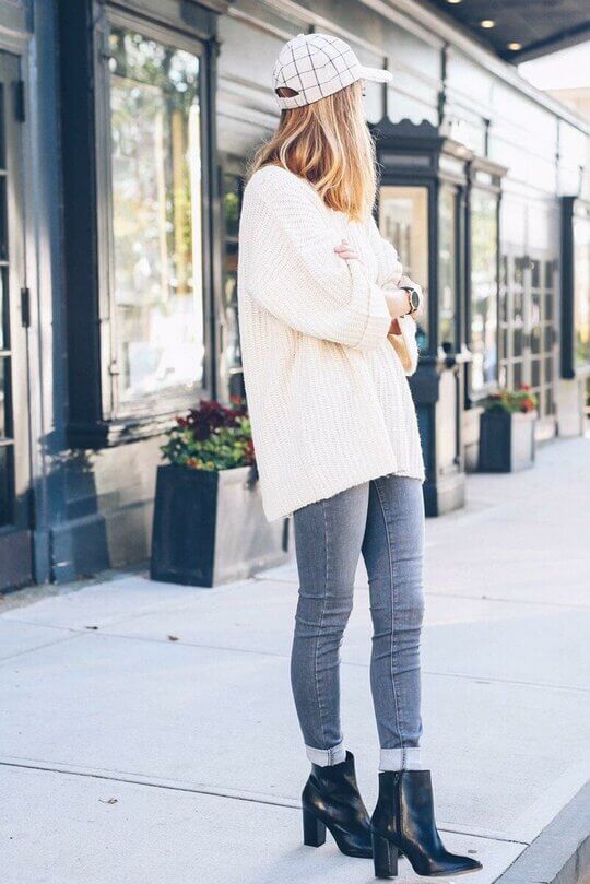 With oversize sweater