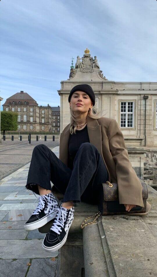 With jacket and sneakers