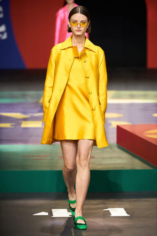 Bright yellow Dior suit with a dress
