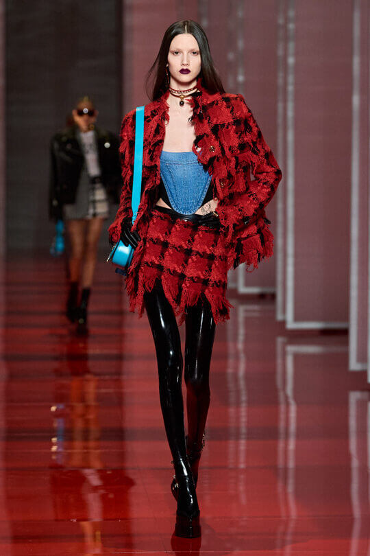 Unusual suit with a skirt by Versace