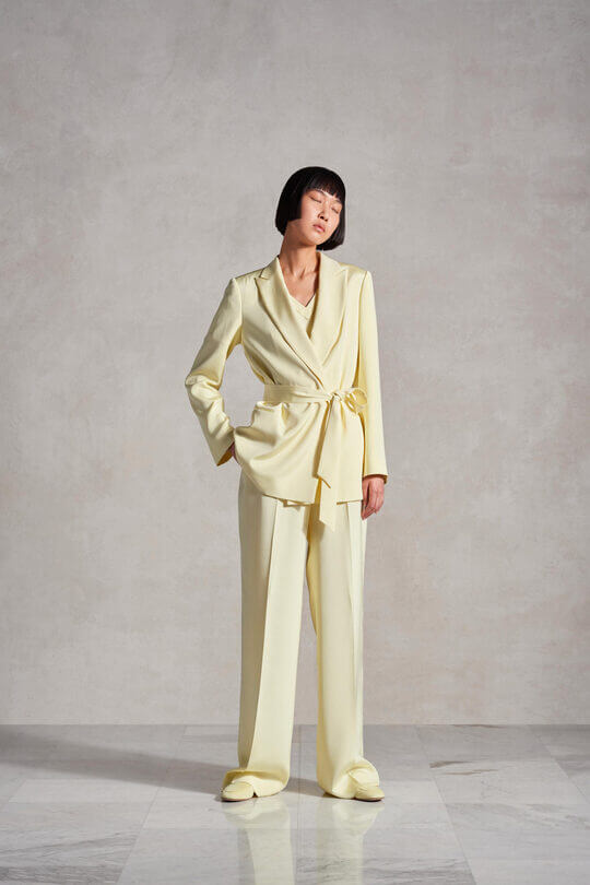 The monochrome look stretches the silhouette and increases height