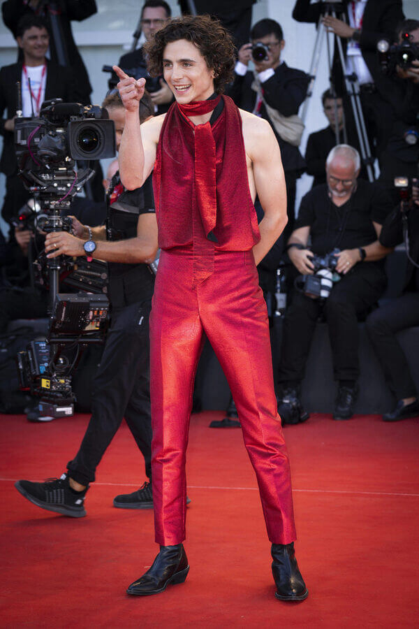 Timothee Chalamet in a red jumpsuit at a cinfosetival in Venice