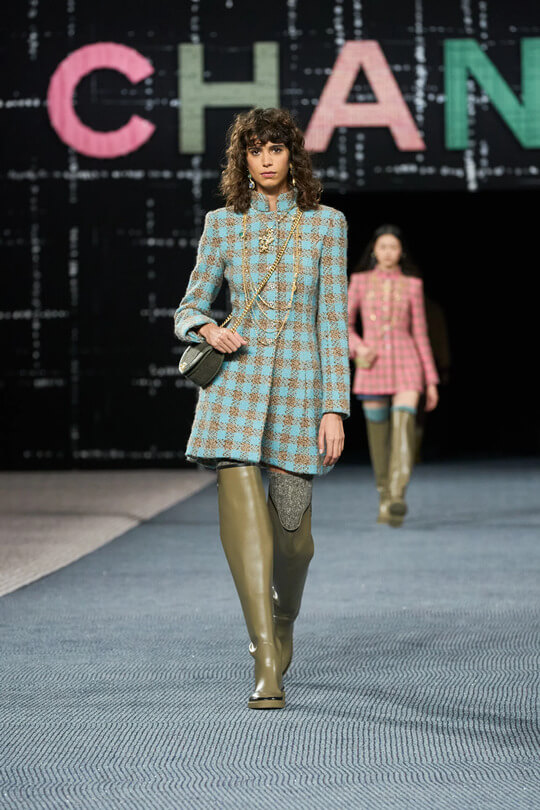 Fashionable rubber boots by Chanel at the show of the new collection 2023
