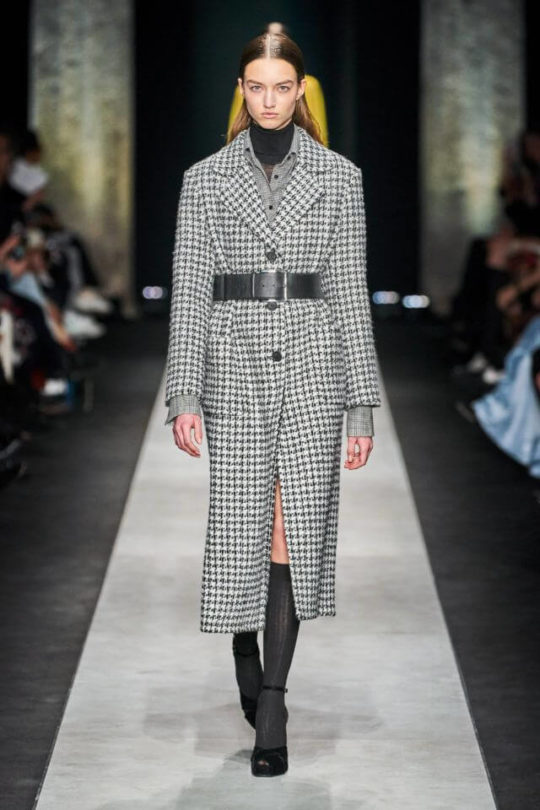 A coat with a belt at the fashion show of Ermanno Scervino new collection