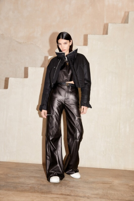 Leather cargos from Amiri with sneakers