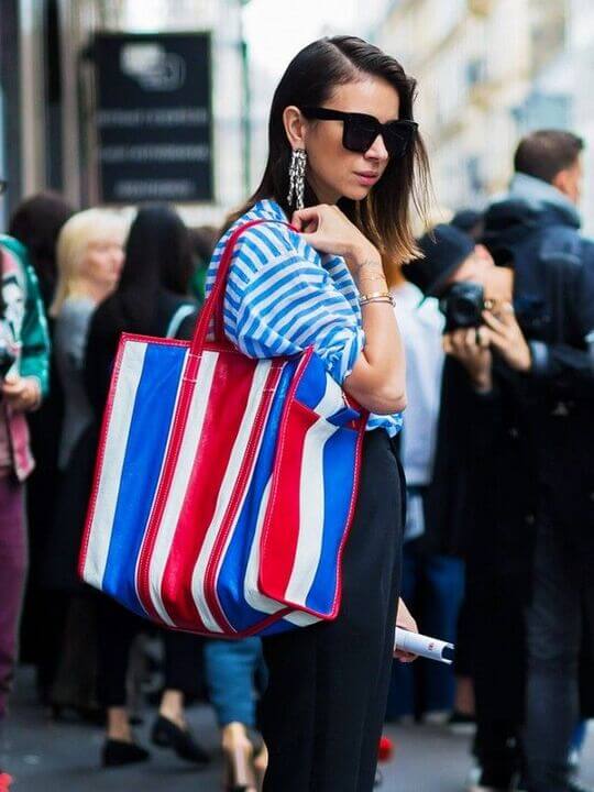 A brightly colored striped shopper