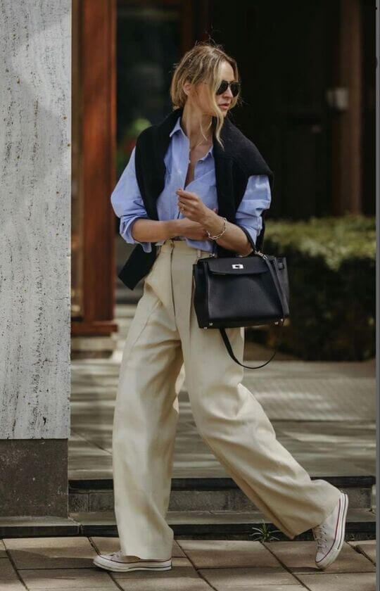 A shirt with rolled up sleeves and wide pants