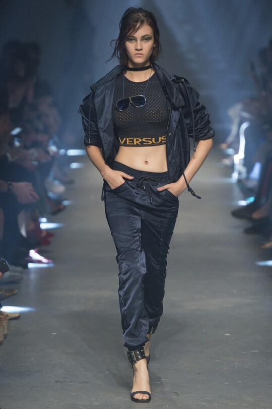 Versace satin joggers at the fashion show